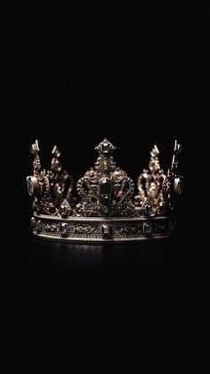 a silver crown sitting on top of a table