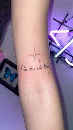 a person with a tattoo on their arm that reads, i the stars we shine