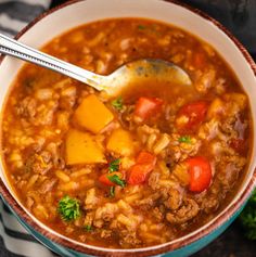 a close up of a bowl of food with a spoon