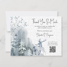 a wedding card with an image of a deer in the woods and snow on it