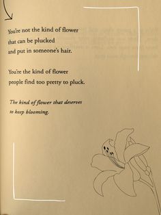 an open book with a drawing of a flower on the page and poem written in it