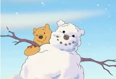 a snowman with a teddy bear sitting on it's back in the snow