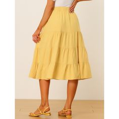 Slant pockets for effortless wear and an A-line tiered flare hem help to create an elegant and flowy look in spring or summer. In a midi length, this skirt with a fit-and-flare silhouette and an elastic waist exudes a carefree summer feel. This midi skirt features a ruffle hem and side pockets for a crisp finish to any look. Pair it with any sandals to create a variety of looks. Flowy Tiered Skirt In Solid Color, Solid Color Tiered Bottoms For Summer, Tiered Bottoms For Summer, Flowy Spring Skirt In Solid Color, Tiered Gathered Skirt In Solid Color, Solid Color Tiered Skirt For Brunch, Solid Color Tiered Gathered Skirt, Spring Knee-length Skirt With Ruffle Hem, Spring Bottoms With Ruffle Hem