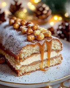 a piece of cake sitting on top of a plate covered in icing and nuts