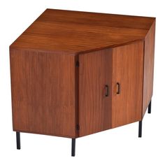 a wooden cabinet with two doors and black legs