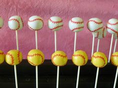 cake pops with baseballs on them sitting in front of a pink wall