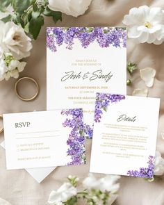 wedding stationery with purple flowers and gold rings