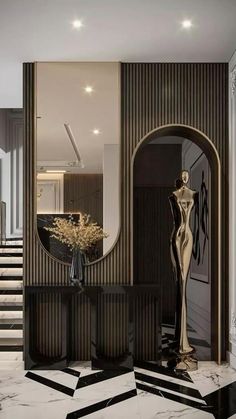 an elegant foyer with marble floors and stairs