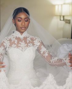 a woman wearing a wedding dress and veil