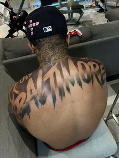 the back of a man's head with tattoos on it, and an instagram