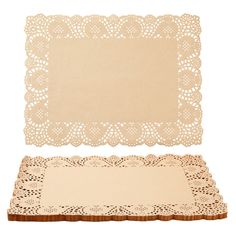 two pieces of paper with lacy doily on them, one in beige and the other in white