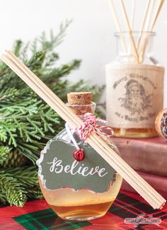 Learn how to make your own essential oil reed diffusers, featuring a delicious Christmas scent of clove, cedarwood, sweet orange and vanilla, in beautiful glass bottles that will enhance your holiday decor. #HandmadeHolidays Smores Christmas, Diy Holiday Gift Wrapping, Christmas Scent