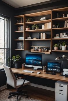 a desk with two computers on it in front of a window and bookshelves