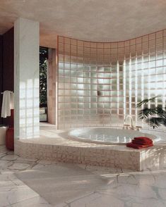 a large white bath tub sitting inside of a bathroom