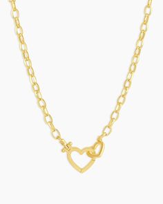 Parker Gold Heart Necklace Add a hint of romance to your everyday look with the gold plated Parker Gold Heart Necklace. This beautiful necklace features a heart hinge closure, which adds a little love to your layered necklaces. Preppy Gold Necklaces, Women Wishlist, Unique Gold Jewelry, Necklace Product, Orange Agate, Yellow Opal, Iridescent Crystal, Snowflake Obsidian, Gold Heart Necklace