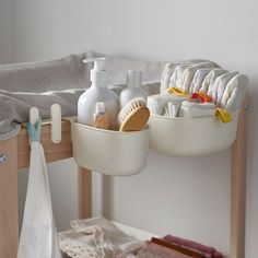 two trays with soap, toothbrushes, and other bathroom items on them