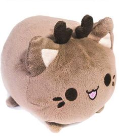 a small stuffed animal with horns on it's head and ears, sitting in front of a white background