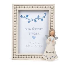 an angel figurine next to a white frame with the words now forever always