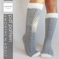 the legs of a woman wearing gray and white knitted socks