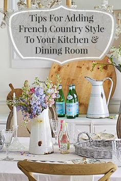 a table with flowers and vases on it in front of a sign that says tips for adding french country style to your kitchen & dining room