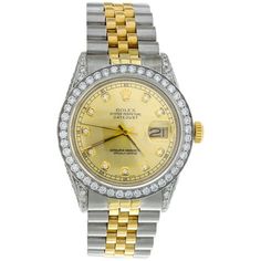 This watch is Genuine Pre-Owned Men's Rolex DateJust 36mm Model (reference # 16013) with custom diamond bezel, dial and side case. This men's Stainless Steel / 18K Yellow Gold Two Tone watch has 5 ct. t.w. of genuine diamonds that are hand set on the side case, lugs, dial and bezel. This is a full size 36mm desired vintage model for Men's. This watch is in excellent condition and looks brand new on the wrist. The original stainless steel case is in excellent condition with no dings, dents or dee Yellow Gold Diamond Watch With Chronograph, Yellow Gold Round Diamond Watch With Chronograph, Anniversary Yellow Gold Diamond Watch With Date Indicator, Yellow Gold Diamond Watch With Chronometer, Formal Yellow Watch With Chronometer, Gold Diamond Chronometer Watch, Automatic Round Diamond Watch For Anniversary, Formal Yellow Automatic Watch, Rolex Datejust 36mm