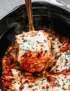 a close up of food being cooked in a slow cooker