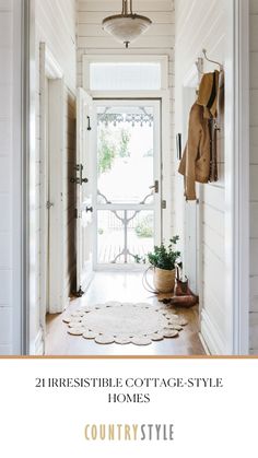 an entryway with white walls and wood floors, the door is open to a porch area