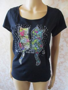 Funky tee shirt in black with two cats sitting on a wall in multi coloured lace with sequins. Really pretty and unusual. Bust flat;  17" Length;  24" cotton Multicolor Cat Print Tops For Summer, Summer Multicolor Cat Print Tops, Multicolor Cat Print Cotton Tops, Black Cat Design Tops For Spring, Trendy Summer Tops With Cat Print, Trendy Cat Print Summer Tops, Trendy Short Sleeve Top With Cat Print, Trendy Cat Print Tops For Summer, Black T-shirt With Cat Print For Summer