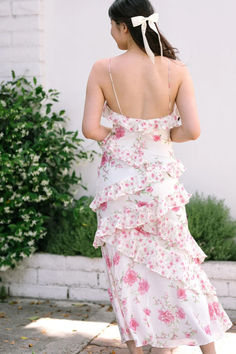 Indulge in romantic style with our Ruffled Maxi Dress, perfect for weddings and special occasions. Embrace elegance with a flattering V-neckline, adding a touch of sophistication. Fixed rolled cami straps ensure a chic and secure fit, while whimsical layered ruffles exude feminine grace and allure. The enchanting floral pattern captures the essence of romance, and the slim-fitting silhouette flaunts your figure beautifully. This dress is the epitome of timeless elegance and feminine charm. #RuffledMaxiDress #RomanticStyle #WeddingFashion #FeminineGrace #ElegantOccasions #FloralCharm Boutique Maxi Dresses, Pink Outfits, Ruffled Maxi Dress, Romantic Style, Pink Aesthetic, Affordable Fashion, Boutique Clothing, Pretty In Pink, Wedding Styles