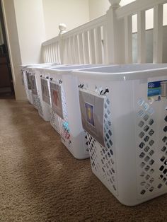 three laundry baskets lined up on the floor