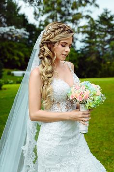 a woman in a wedding dress holding a bouquet