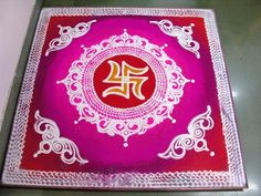 a pink and red plate with white designs on it