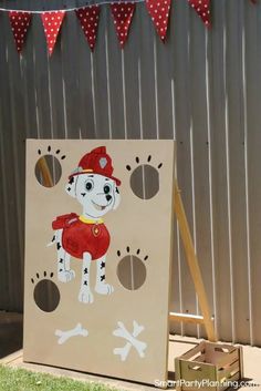 a cardboard board with a dog painted on it