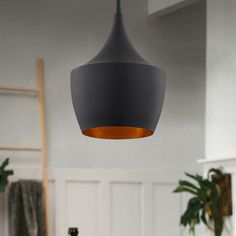 a modern light fixture hanging from the ceiling