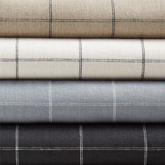 four different plaid fabrics stacked on top of each other