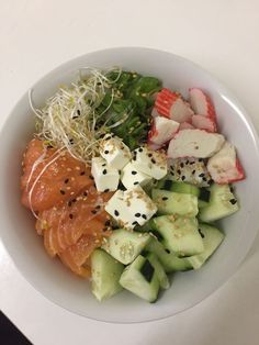 a white bowl filled with different types of food