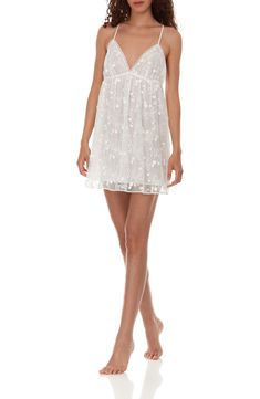 Sweet flowering vines are embroidered on a wispy, romantic chemise finished with dainty crossback straps. 21" center front (size medium) V-neck Adjustable straps Soft cups Lined 100% polyester Hand wash, dry flat Imported Delicate Camisole Dress, Elegant Spring Chemise With Lace Trim, Delicate White Dress For Daywear, Sheer Feminine Chemise, V-neck Summer Chemise For Wedding Night, Elegant Spring Chemise For Daywear, Delicate Spring Wedding Night Dresses, Delicate Spring Dress With Delicate Straps, Feminine Lace Chemise For Daywear