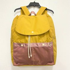 New With Tag Backpack By Madewell Large Size Color: Toffee Yellow Made Of Nylon Material Drawstring And Snap Button Closure Multiple Pockets - External Sides And Front Pockets, Interior Zipped Pocket Padded Adjustable Shoulder Straps Nylon Lining Lightweight Dimensions: 14 X 6 X 17 Inches Madewell Bags, Pokemon Trainer, Toffee, Snap Button, Shoulder Straps, Large Size, Madewell, Bag Lady, Style Inspiration