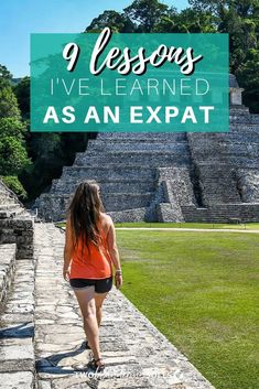 a woman walking down a path with the words 9 lessons i've learned as an expat