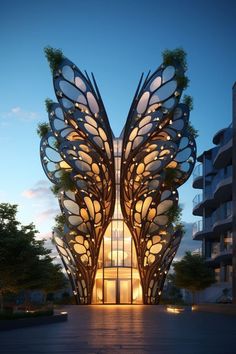 a large butterfly shaped building with lots of windows and plants on it's wings