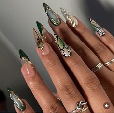 Cool Nail Sets, Faerie Nail Art, Resin Nails Design, Green Groovy Nails, Nails With Gems And Charms, Christmas Butterfly Nails, Gem Stone Nail Art, Short Pink And Gold Nails, Green Butterfly Nail Designs