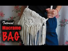 there is a woman holding a macrame bag