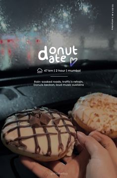 two donuts with chocolate icing and sprinkles are being held by someone's hand