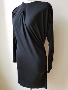 Description Size 40   This is a lovely dress by Lanvin ALBER ELBAZ in "Black"100% Viscose.   This long sleeve dress has an asymmetrical design. COLLECTIBLE !! It is marked a French size 4, a US size 10, and measures approximately: 14" shoulder to shoulder, up to 46" bust, 38" waist, 35" hips, and 38" long from top of shoulder to the hem.    The dress is in excellent condition. Elegant Dresses With Draped Sleeves For Fall, Elegant Fall Dresses With Draped Sleeves, Black Long Sleeve Midi Dress With Draped Sleeves, Long Sleeve Stretch Midi Evening Dress, Black Long Sleeve Dress With Draped Sleeves, Formal Fall Dress With Draped Sleeves, Formal Dresses With Draped Sleeves For Fall, Formal Fitted Long Sleeve Silk Dress, Elegant Long Sleeve Ruched Dress