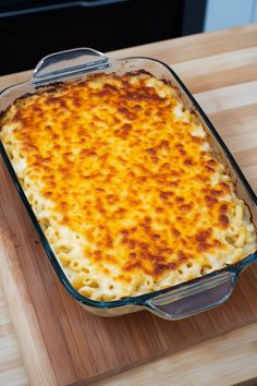 a casserole dish is sitting on a cutting board