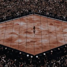 an aerial view of a tennis court with spectators