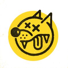 a black and yellow drawing of a cat's face in the center of a circle