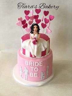 a bride to be cake with hearts on top