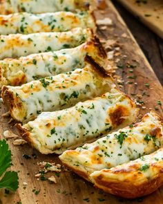 cheesy bread sticks on a cutting board with parsley