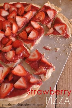 sliced strawberries are arranged on top of a cookie sheet and ready to be eaten